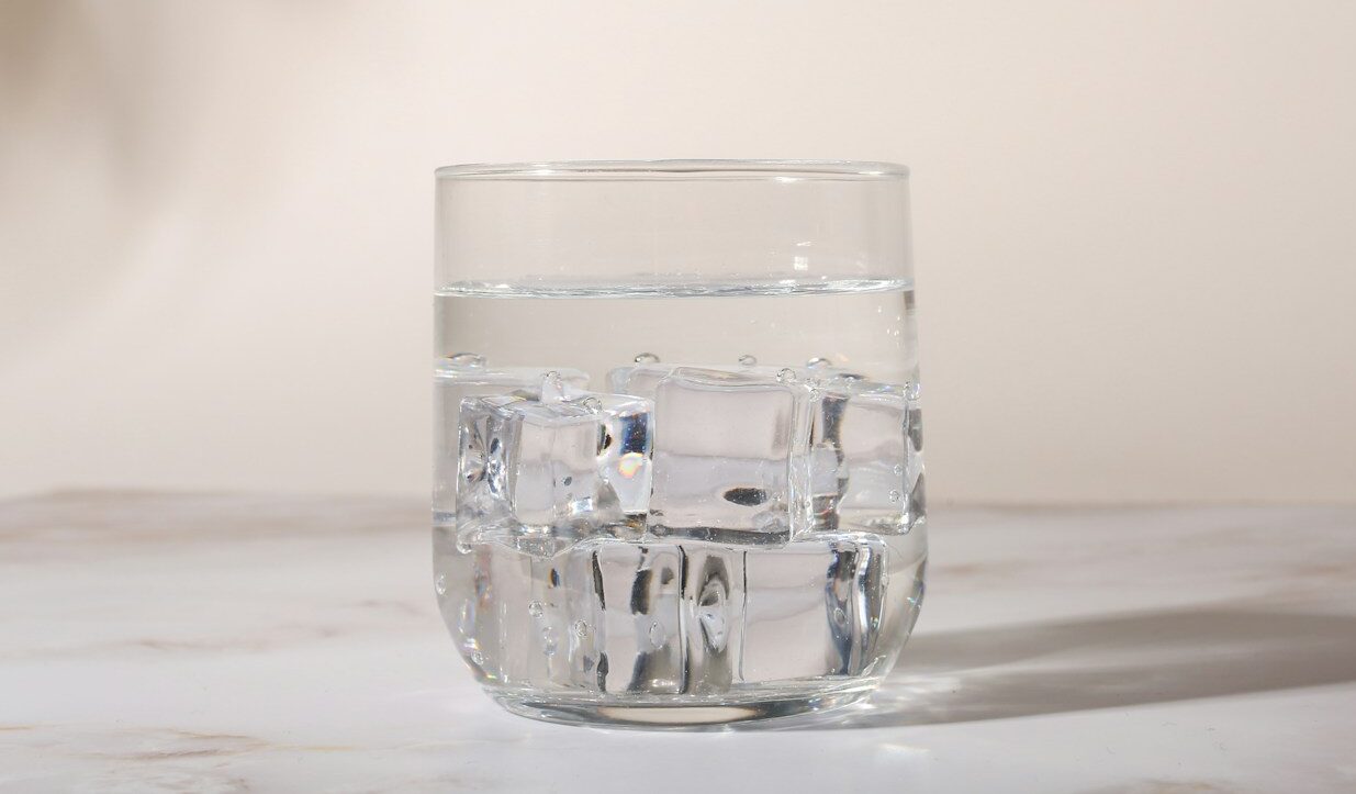clear drinking glass on white table